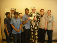 The pearly King and Prince present their donations